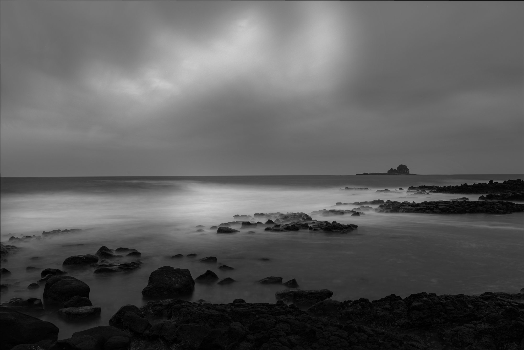 Rocky shore with island